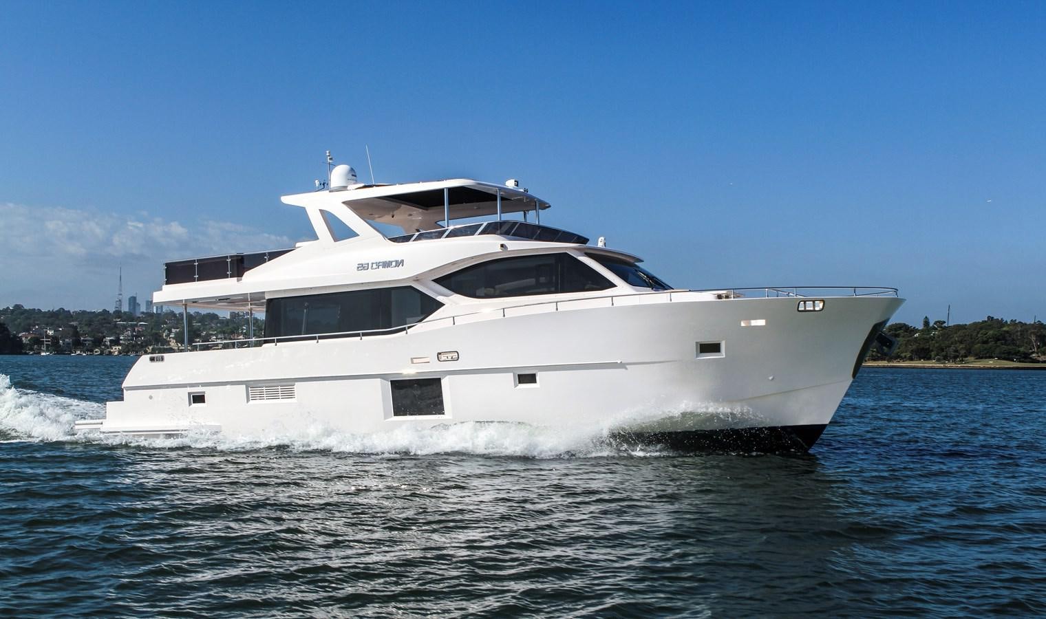 a white yacht on the water aboard NOMAD 65 Yacht for Sale