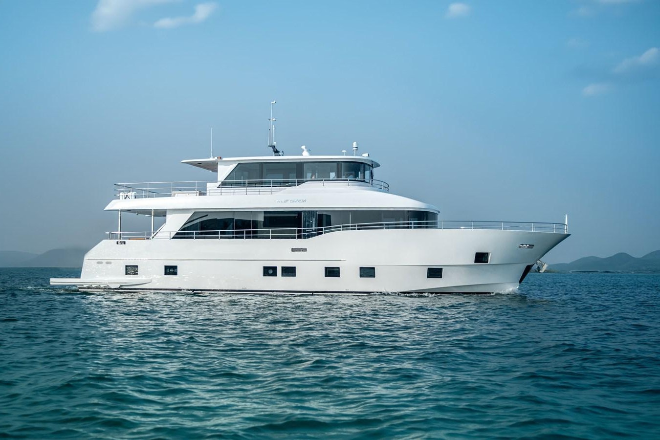 a white boat in the water aboard #4 NOMAD 75 SUV Yacht for Sale