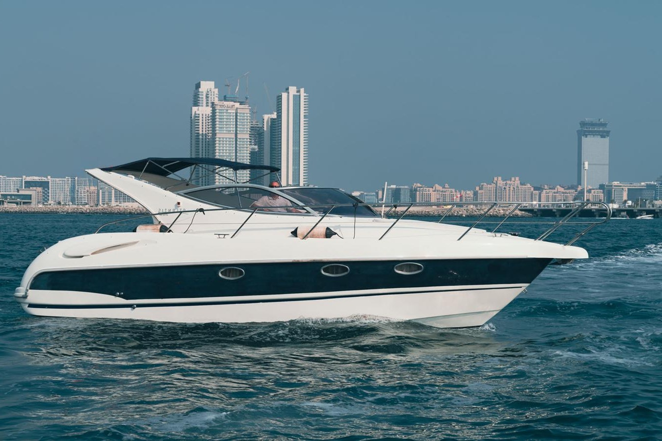 a white boat in the water aboard 2009 ATLANTIS 315 Yacht for Sale