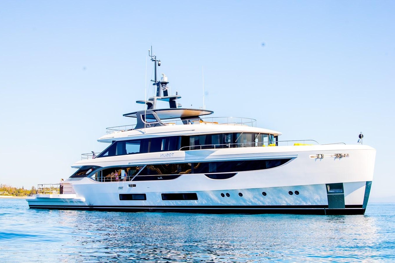 a large white boat in the water aboard TOSUN Yacht for Sale
