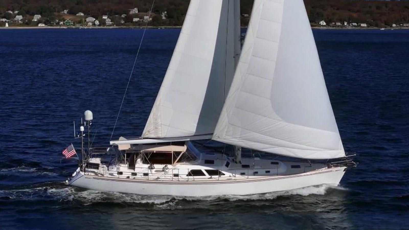 a boat sailing on the water aboard TRIUMPH Yacht for Sale