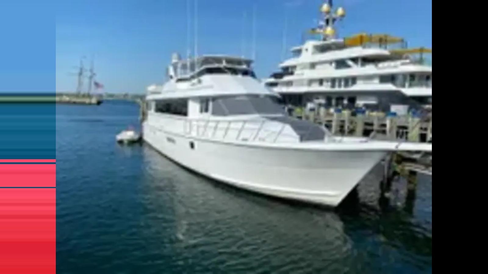 a large white ship aboard 1999 HATTERAS 74 SPORT DECK MOTOR YACHT Yacht for Sale