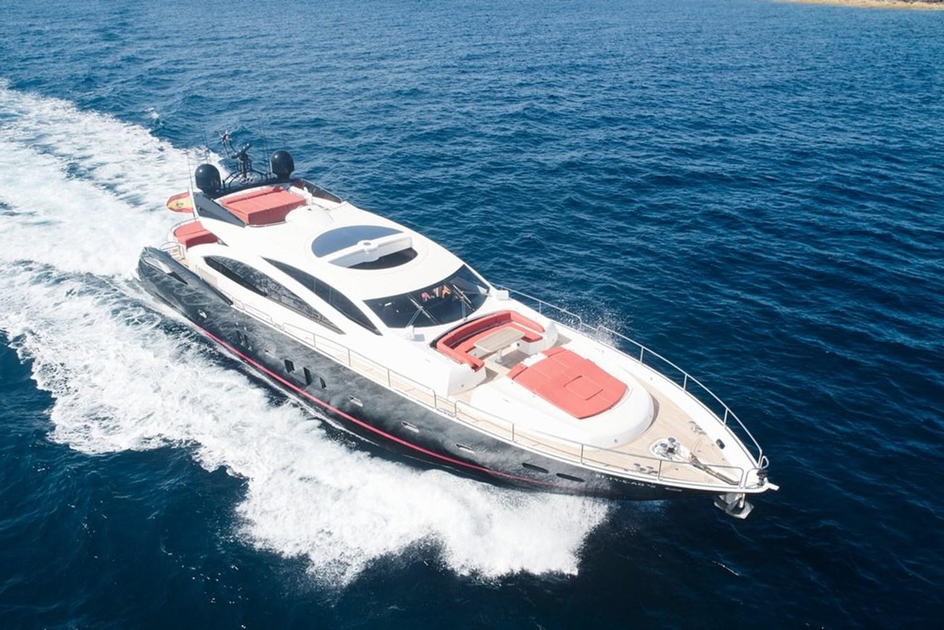 a white and red boat in the water aboard SUNSEEKER PREDATOR 92 Yacht for Sale