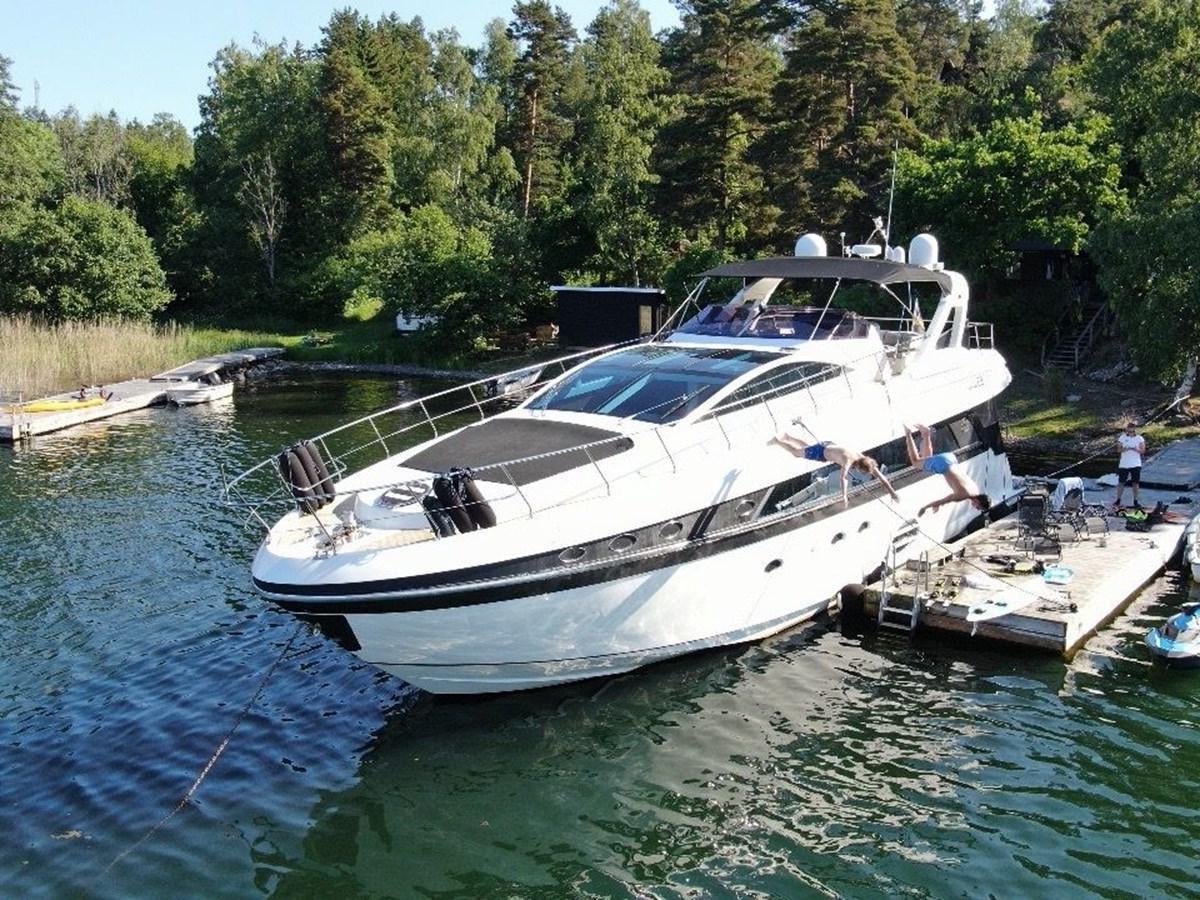 a boat docked at a dock aboard CONAM 65 FLYBRIDGE Yacht for Sale