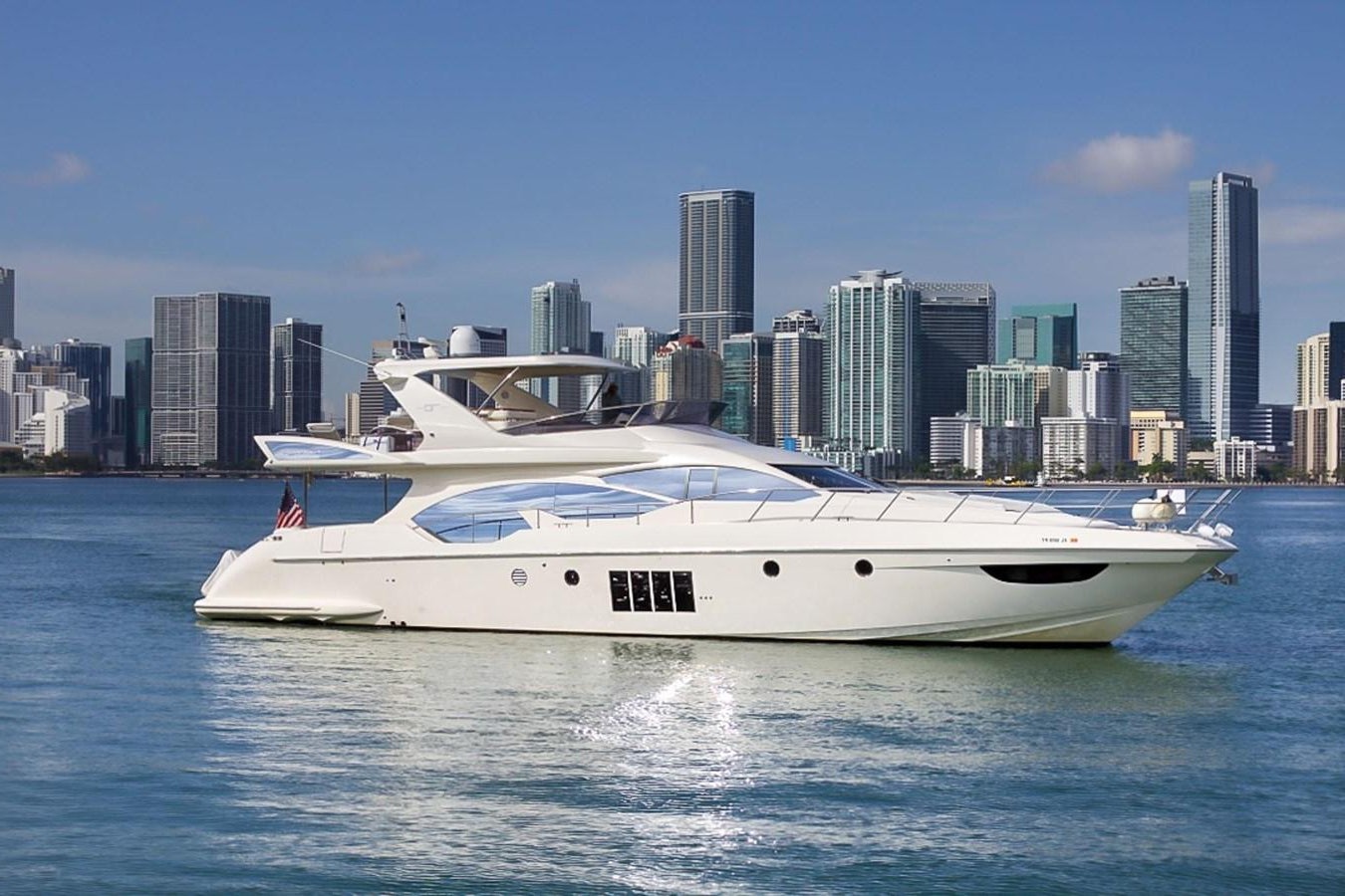 a white yacht in the water aboard 70 Yacht for Sale