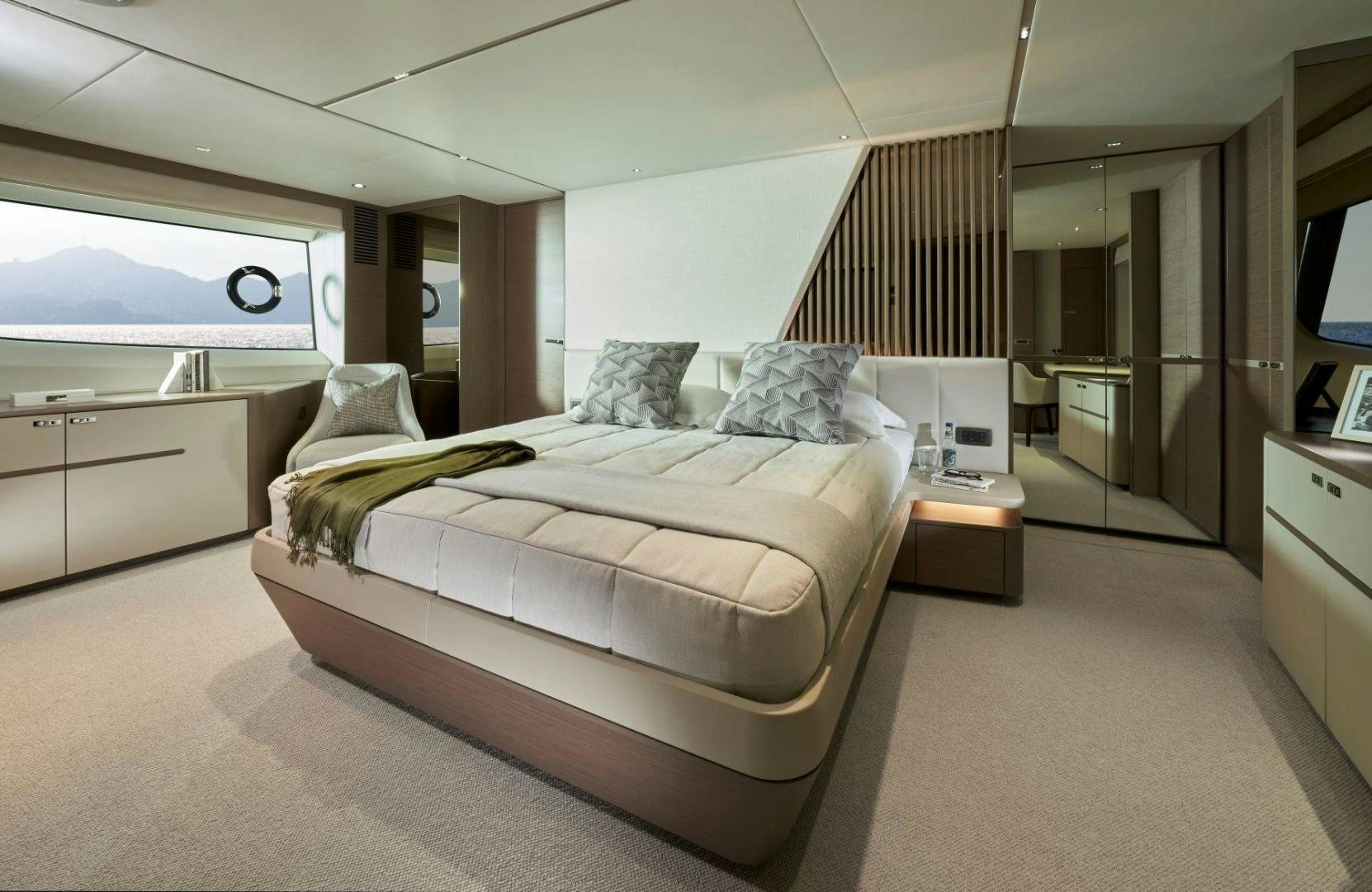 a bedroom with a bed and a desk aboard Y85 Yacht for Sale