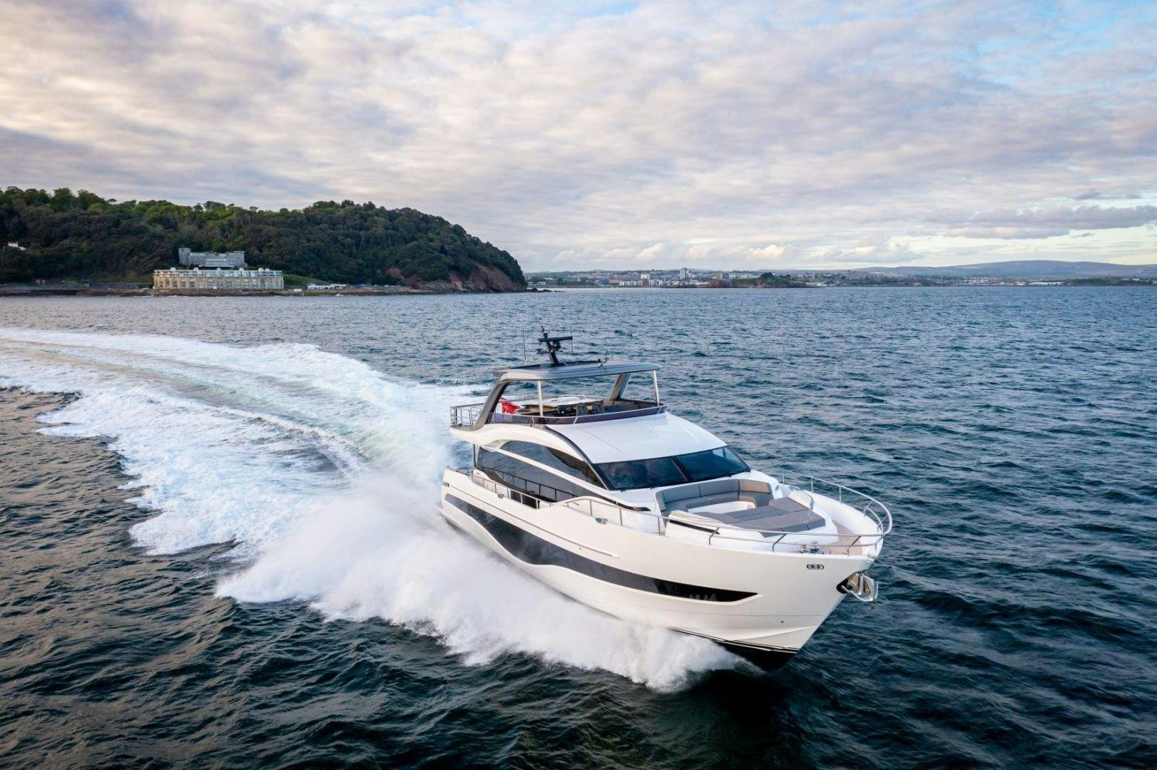 a white boat on the water aboard Y85 Yacht for Sale