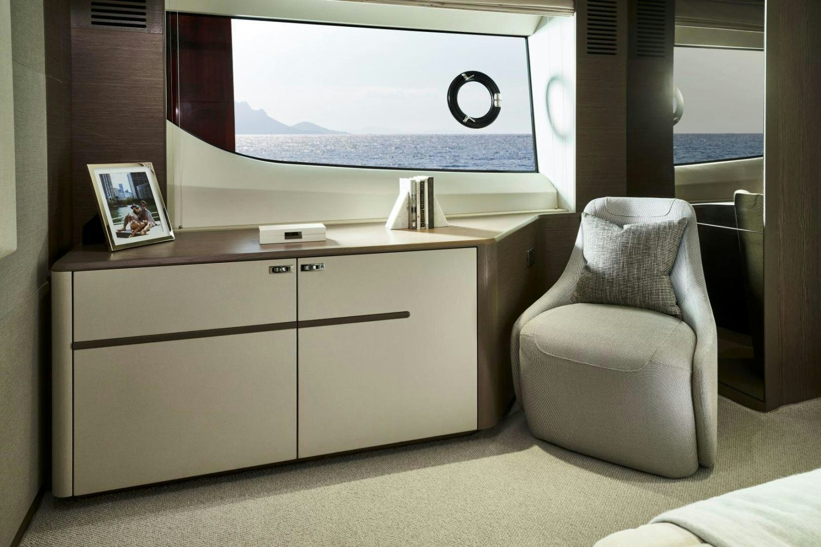 a chair and a television in a room aboard Y85 Yacht for Sale