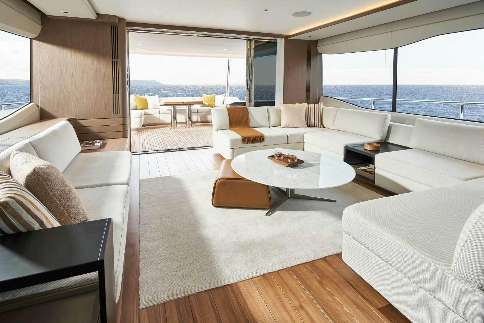 a living room with a large window aboard Y85 Yacht for Sale