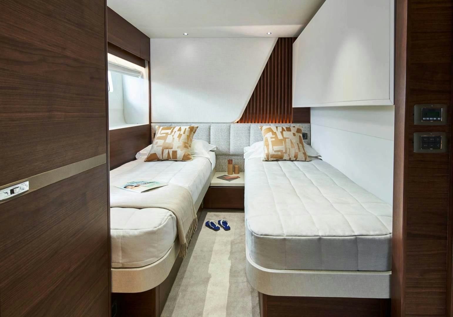 a room with two beds aboard Y85 Yacht for Sale