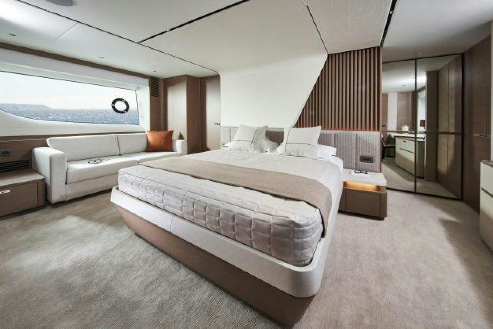 a room with a bed and a large window aboard Y85 Yacht for Sale