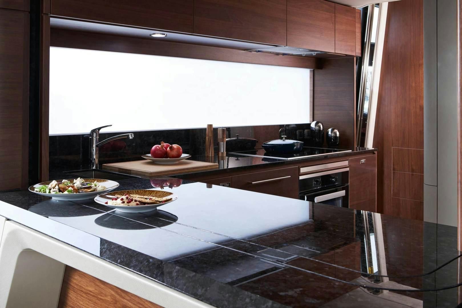 a kitchen with a stove and a sink aboard Y85 Yacht for Sale