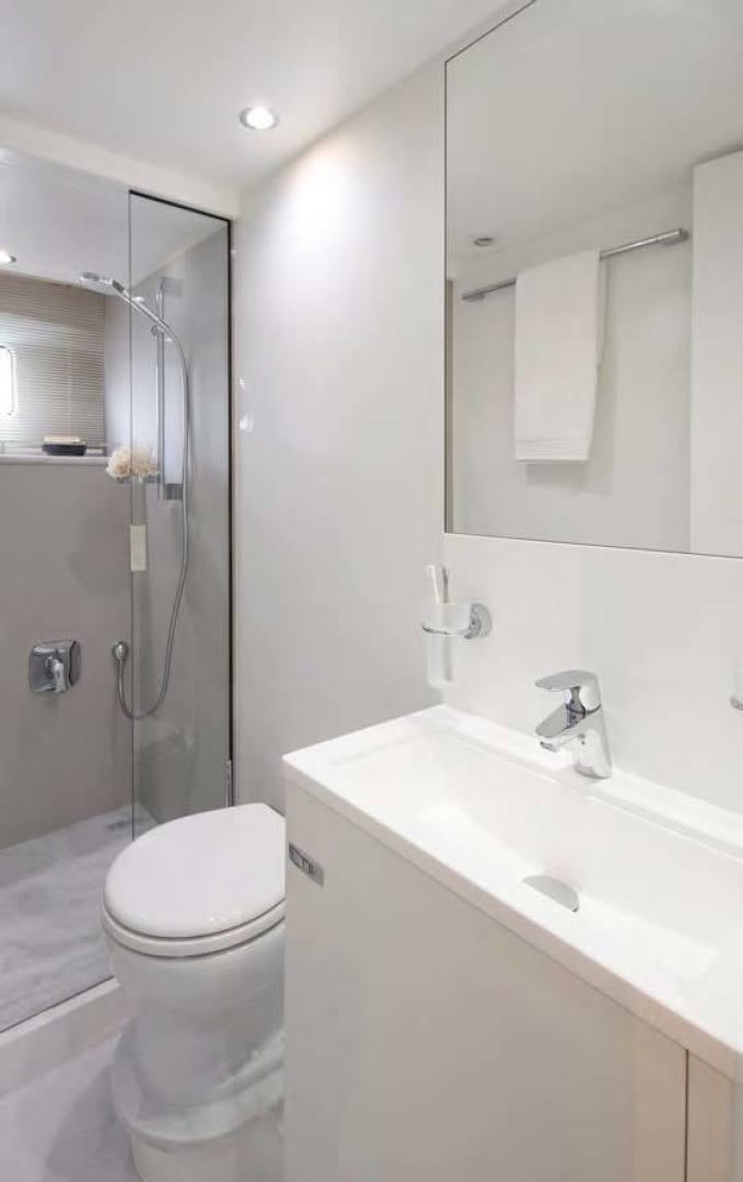 a bathroom with a toilet and sink aboard Y85 Yacht for Sale
