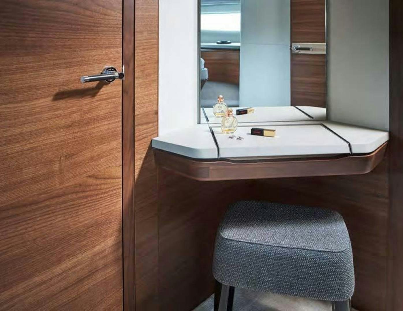 a desk with a chair and a mirror aboard Y85 Yacht for Sale