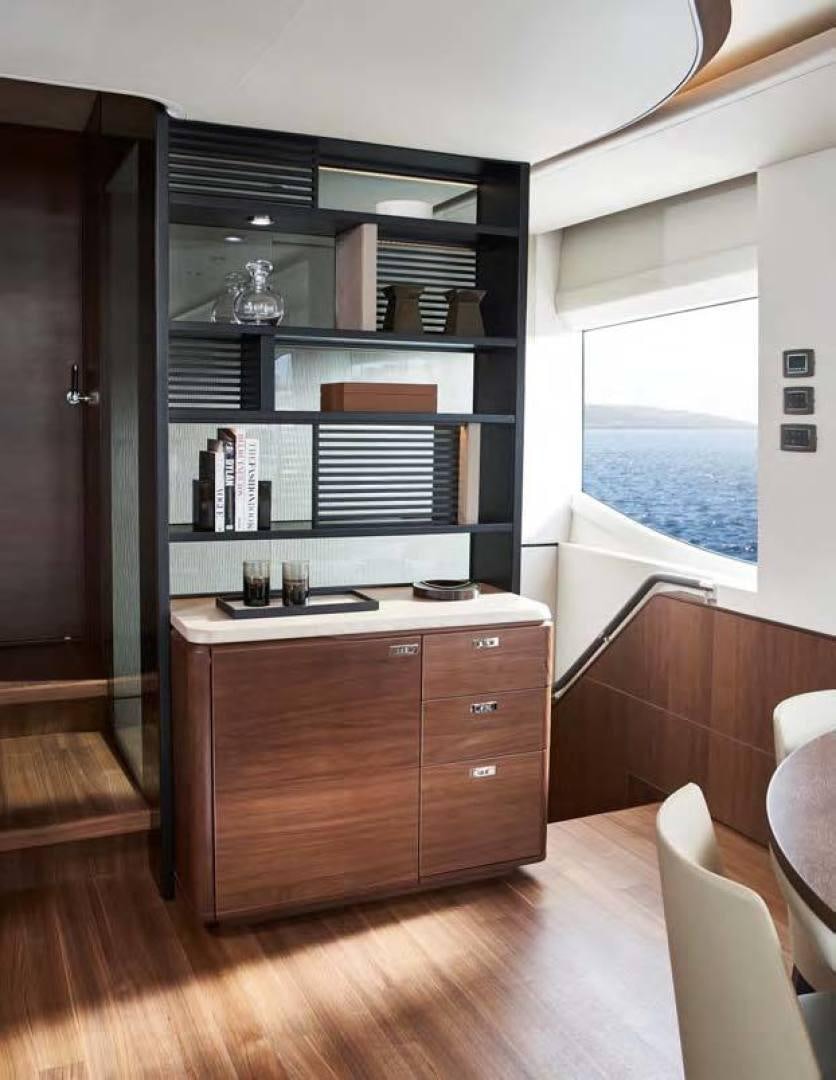a room with a desk and a window aboard Y85 Yacht for Sale