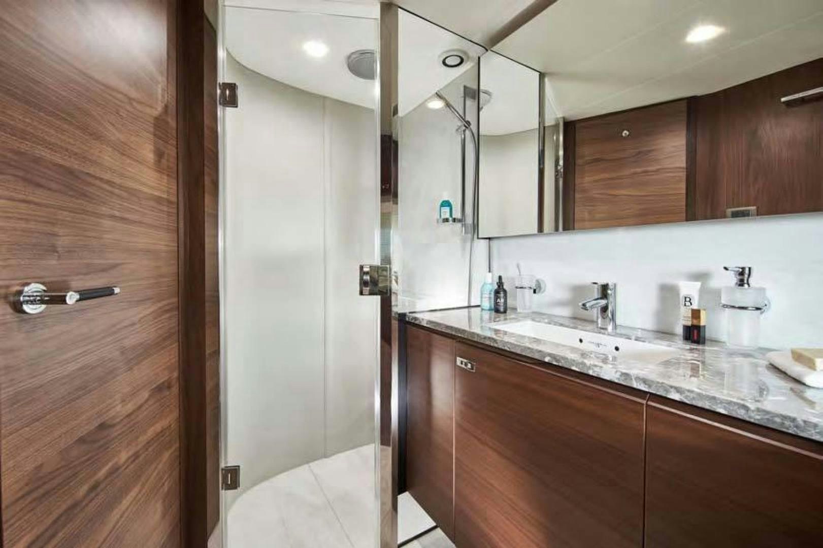 a bathroom with a large mirror aboard Y85 Yacht for Sale