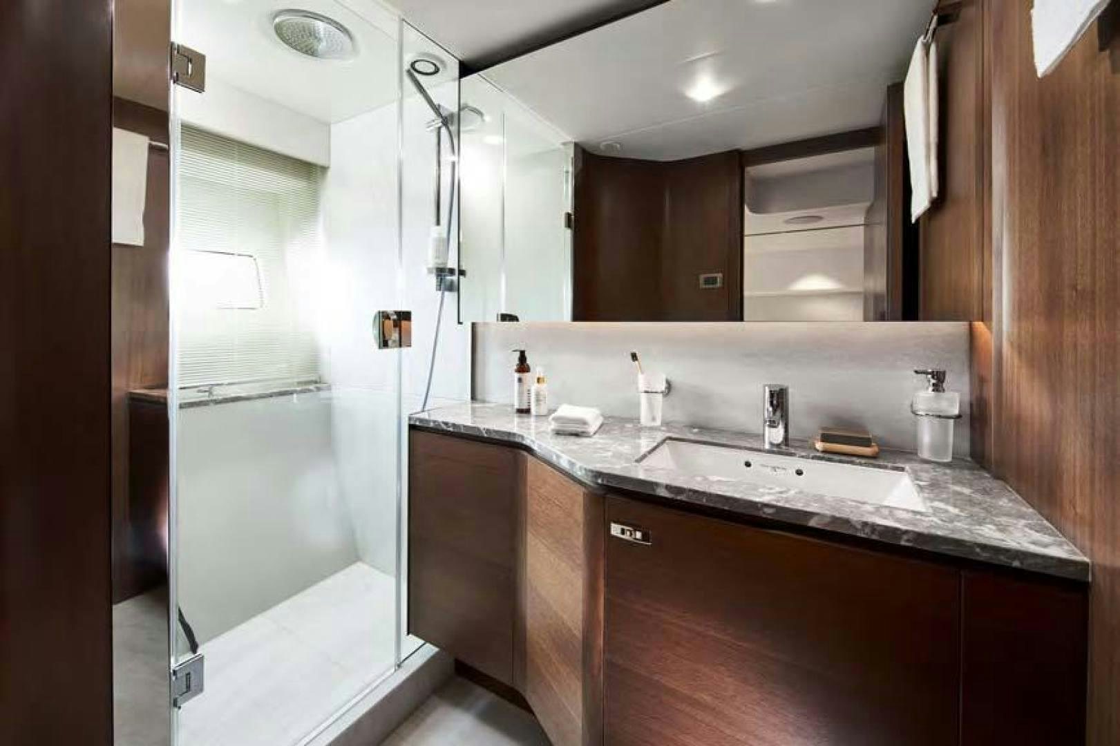 a bathroom with a sink and a mirror aboard Y85 Yacht for Sale