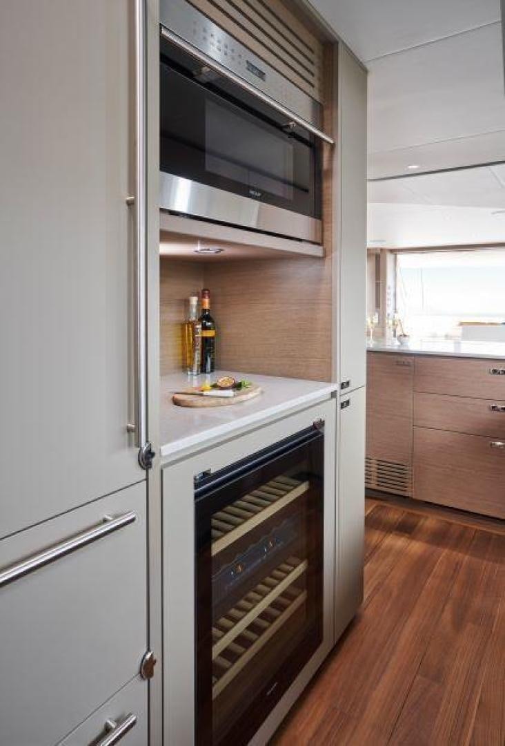 a kitchen with a stainless steel oven aboard Y85 Yacht for Sale