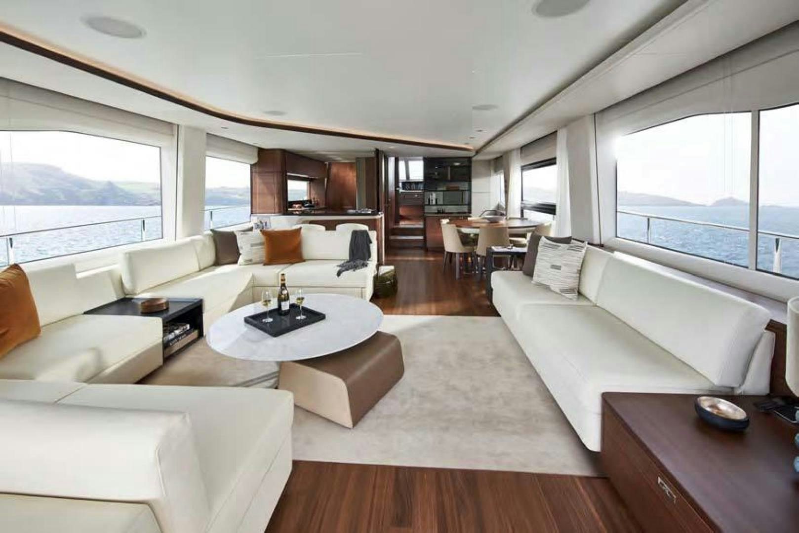 a living room with a large window aboard Y85 Yacht for Sale