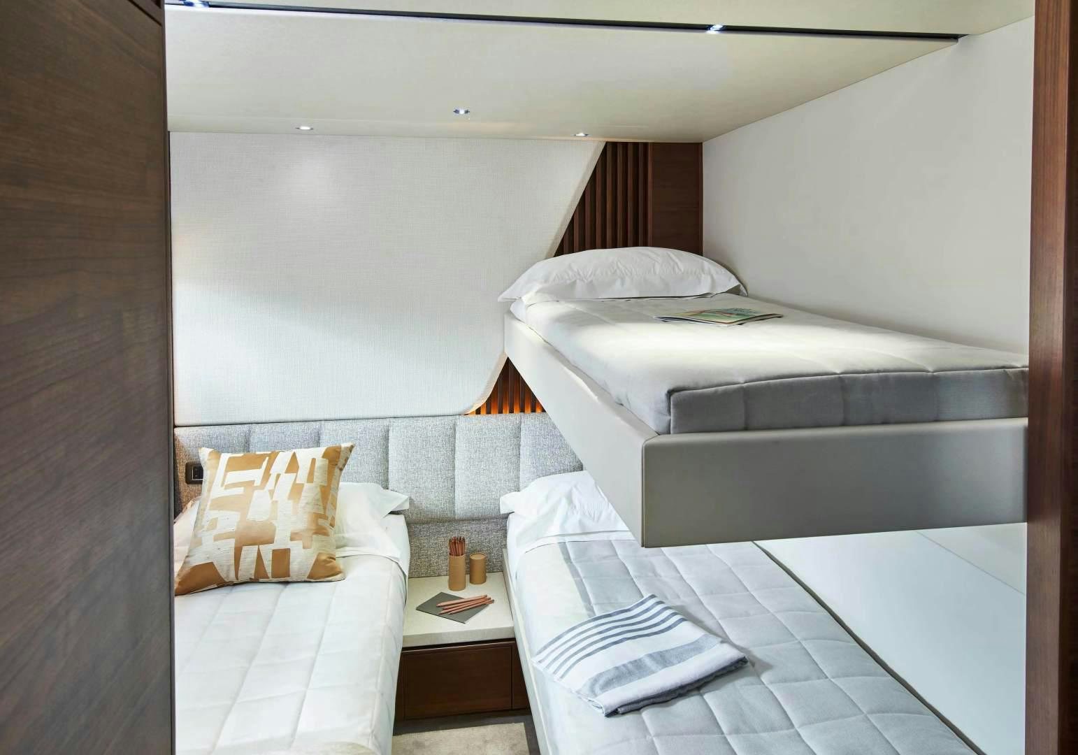 a room with two beds aboard Y85 Yacht for Sale