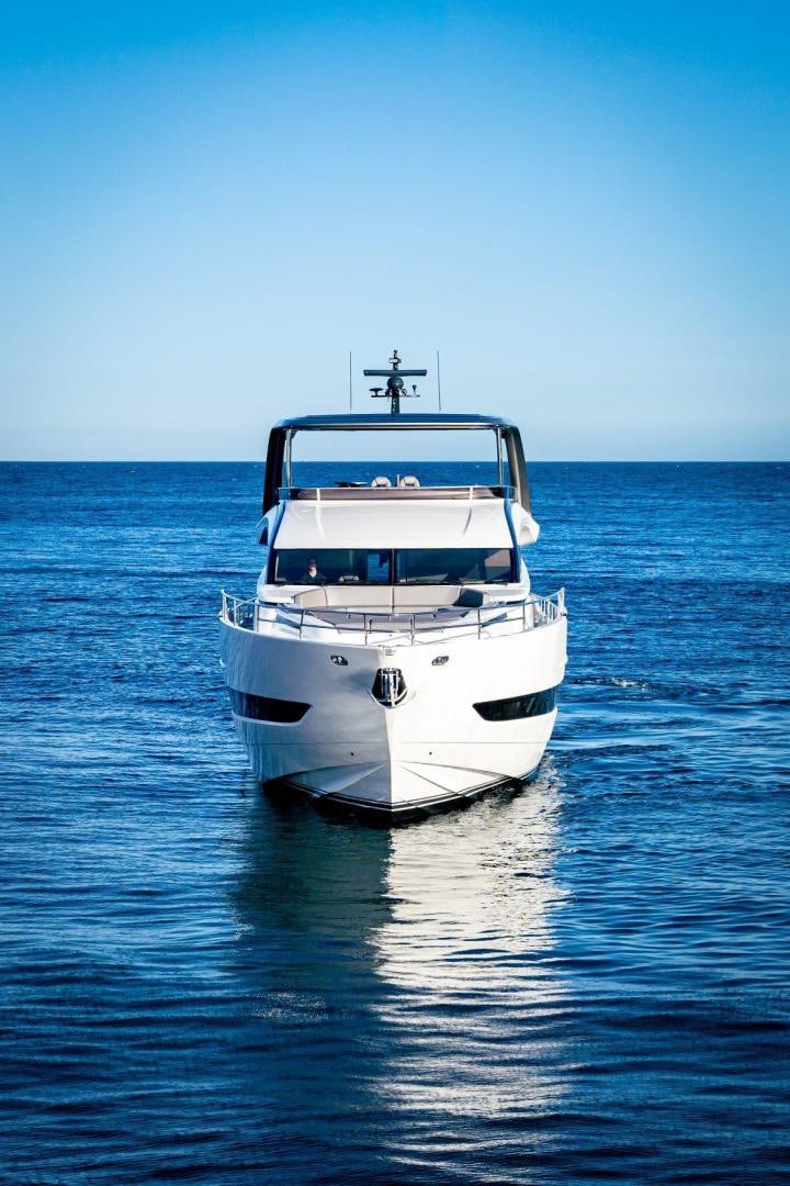 a white boat in the water aboard Y85 Yacht for Sale