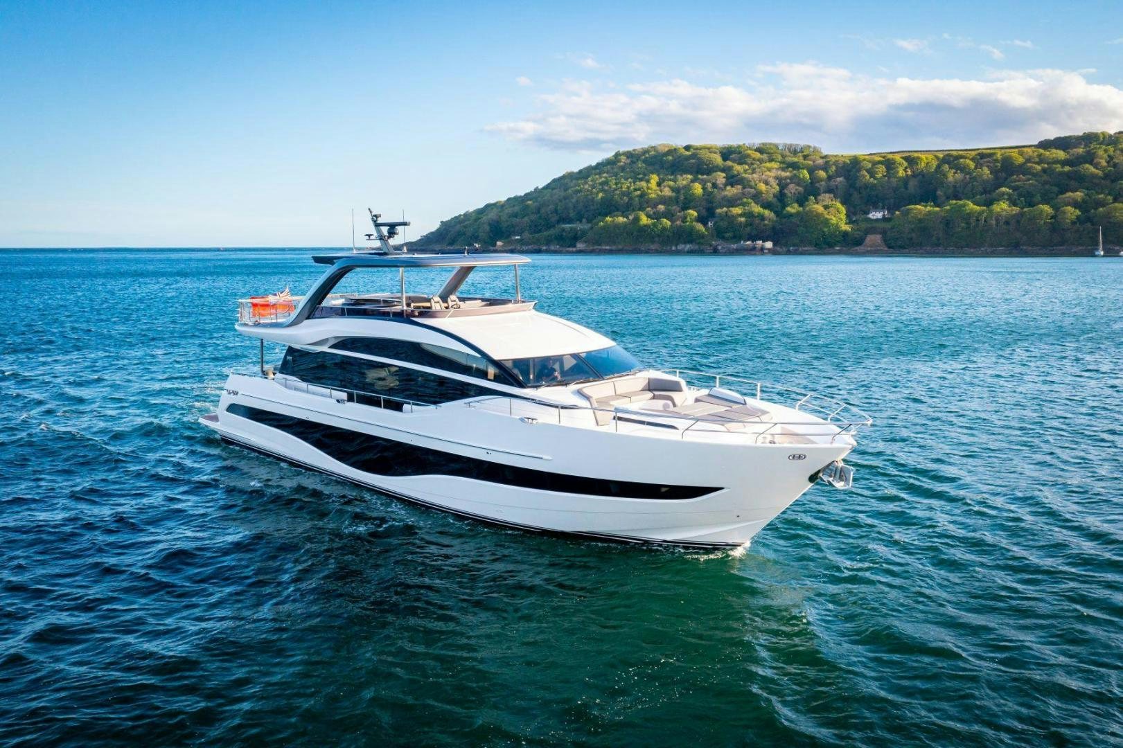 a white boat on the water aboard Y85 Yacht for Sale