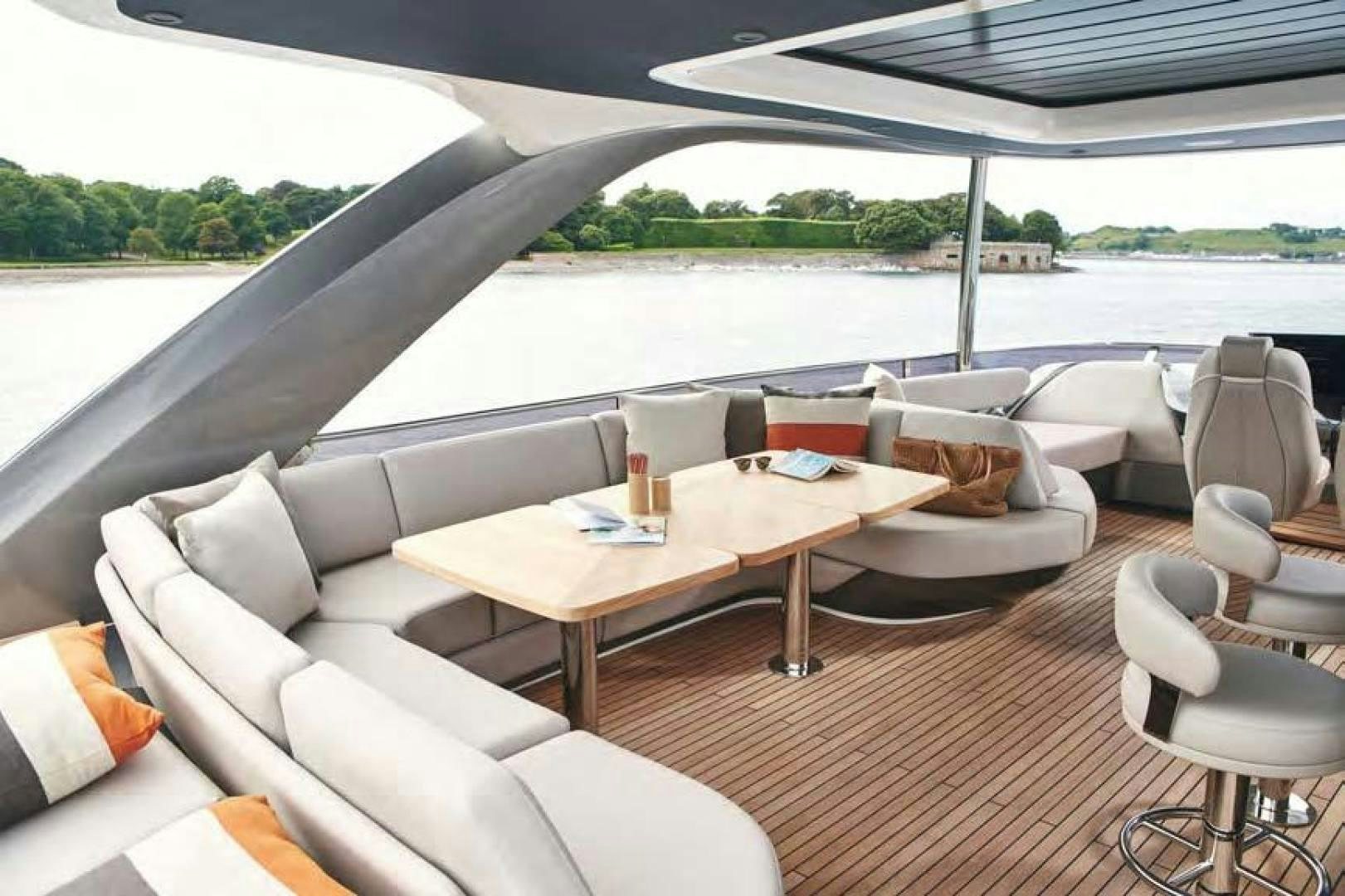 a table and chairs on a boat aboard Y85 Yacht for Sale