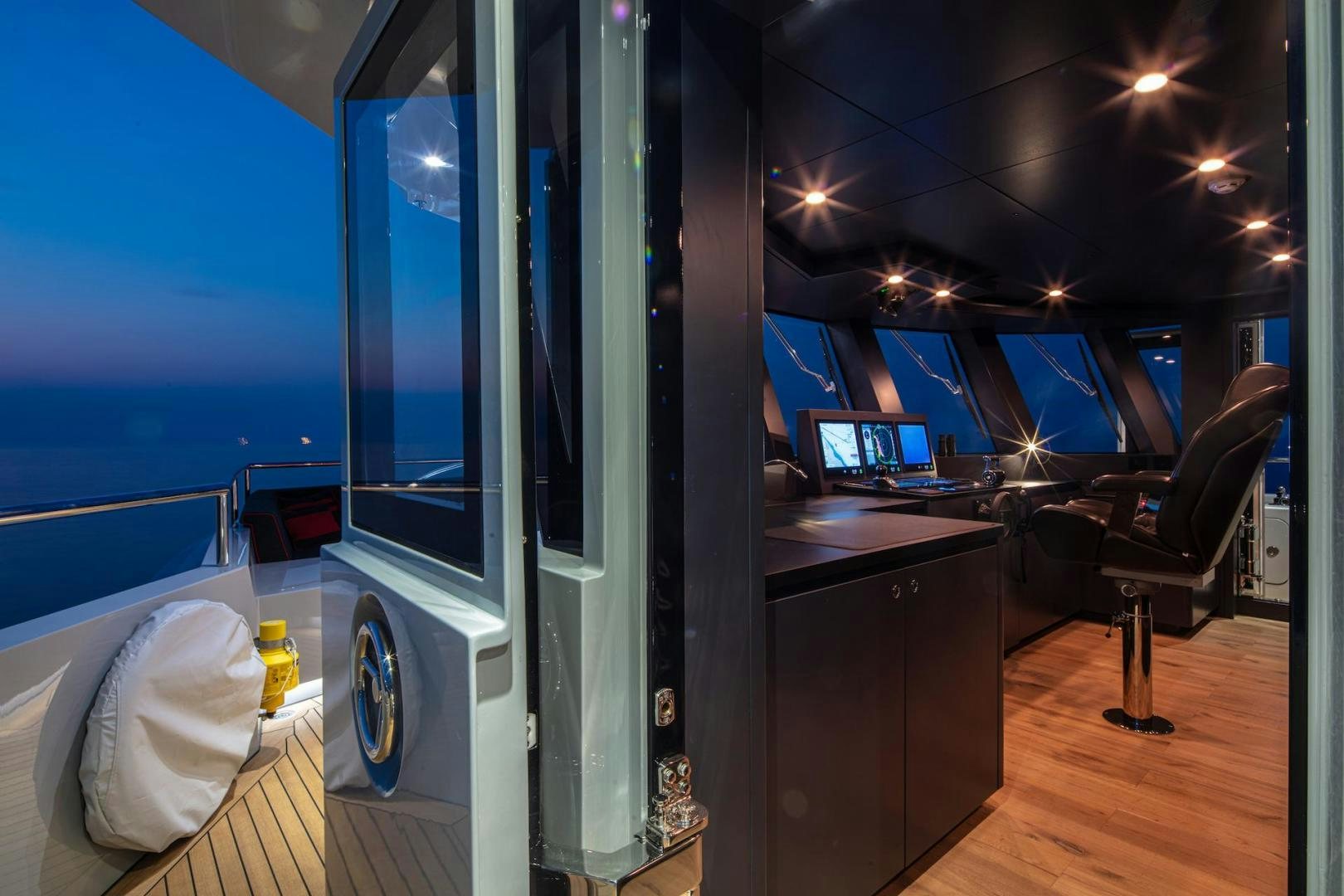 a room with a large window aboard ATOM Yacht for Sale