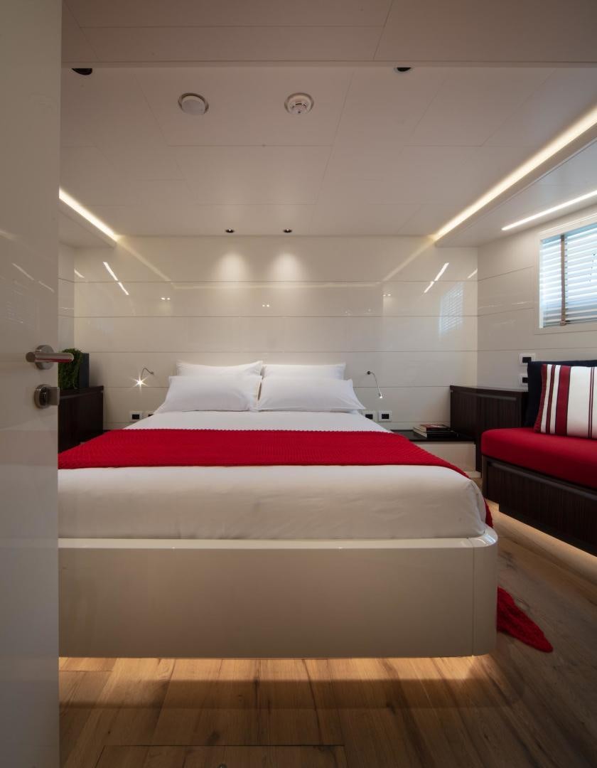 a bed in a room aboard ATOM Yacht for Sale