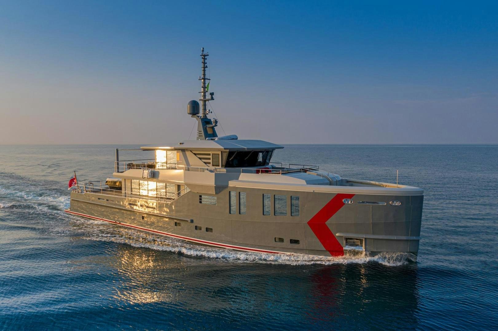 a large ship in the water aboard ATOM Yacht for Sale