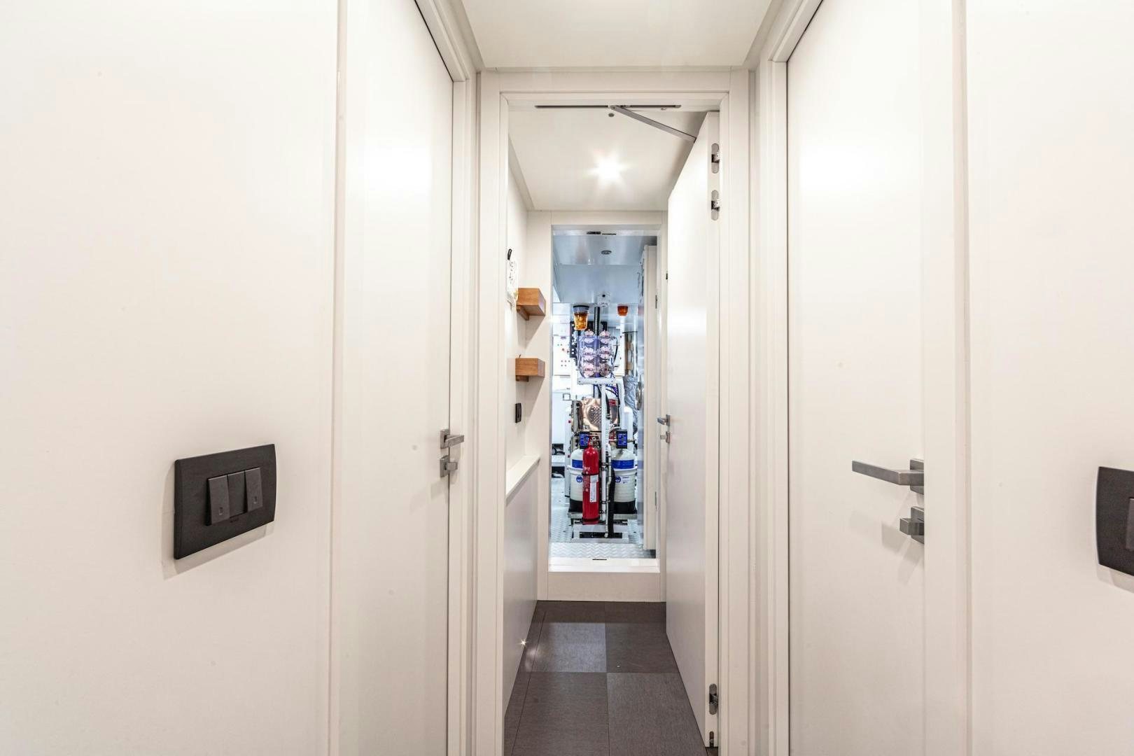a hallway with doors aboard ATOM Yacht for Sale