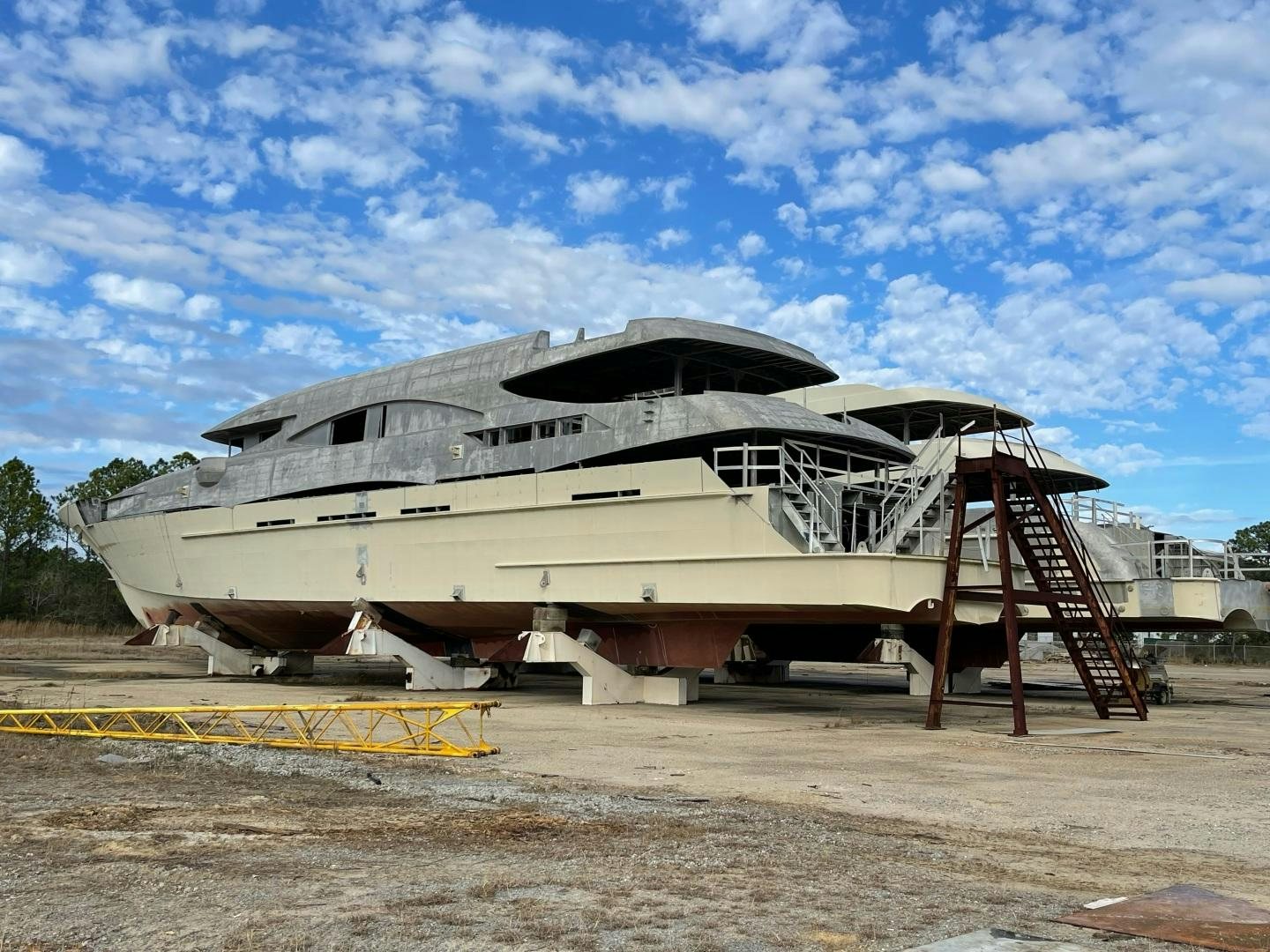 a building with a staircase aboard TRINITY T052 Yacht for Sale