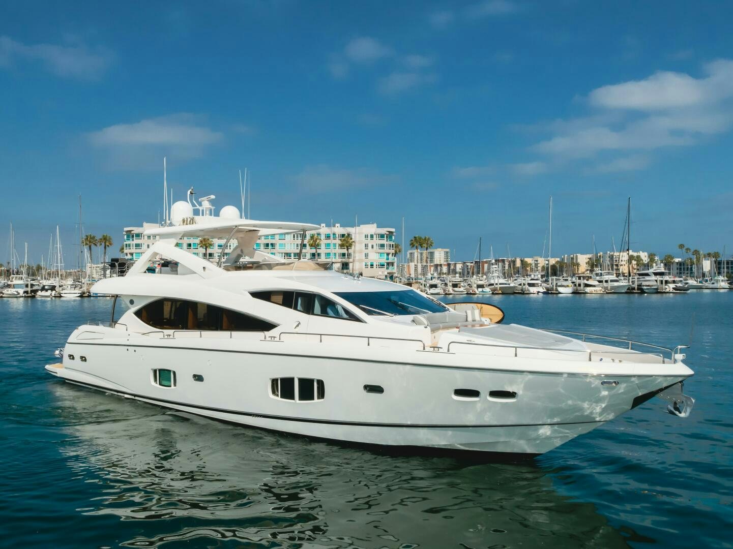 a white yacht in the water aboard INDECENT PROPOSAL IV Yacht for Sale
