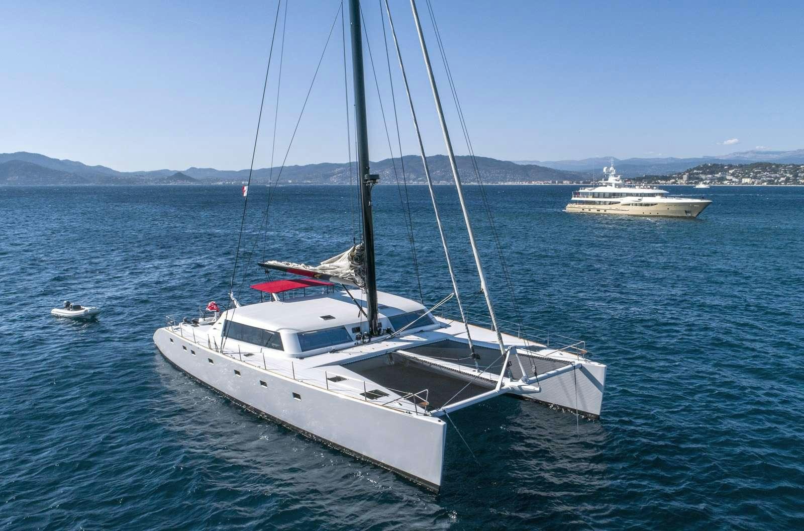 a white boat in the water aboard TAJ Yacht for Charter