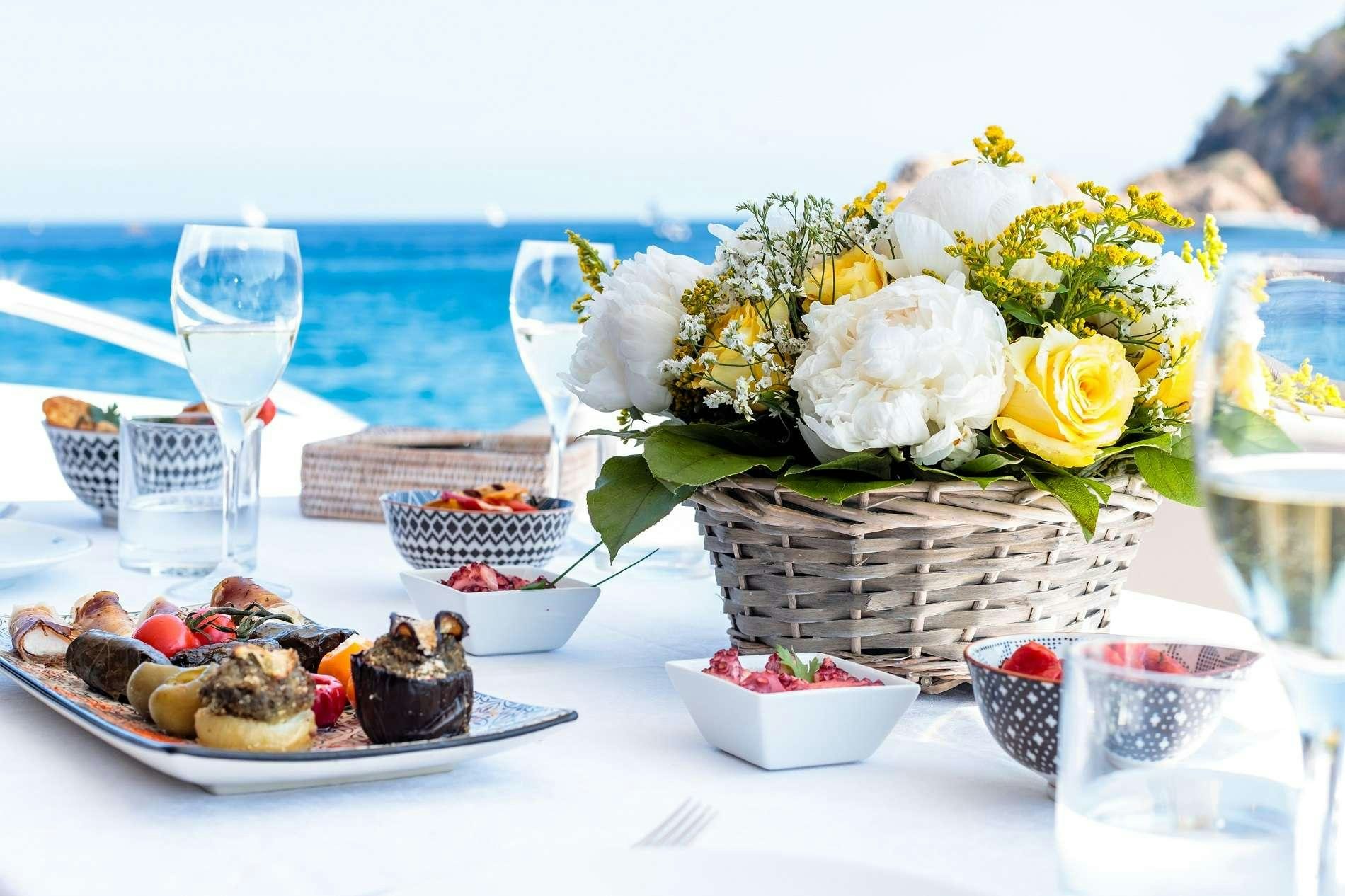 a table with food and drinks aboard NELENA Yacht for Charter
