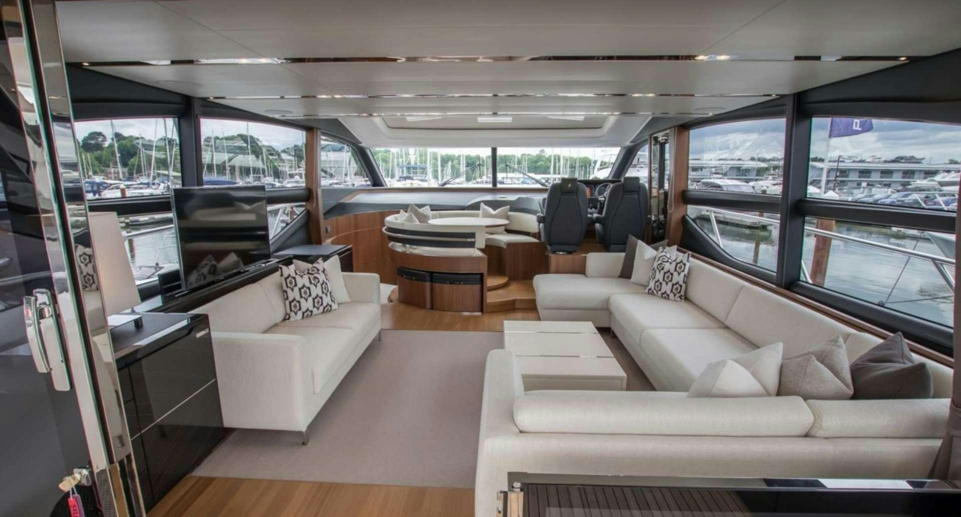 a living room with a couch and a table aboard NELENA Yacht for Charter