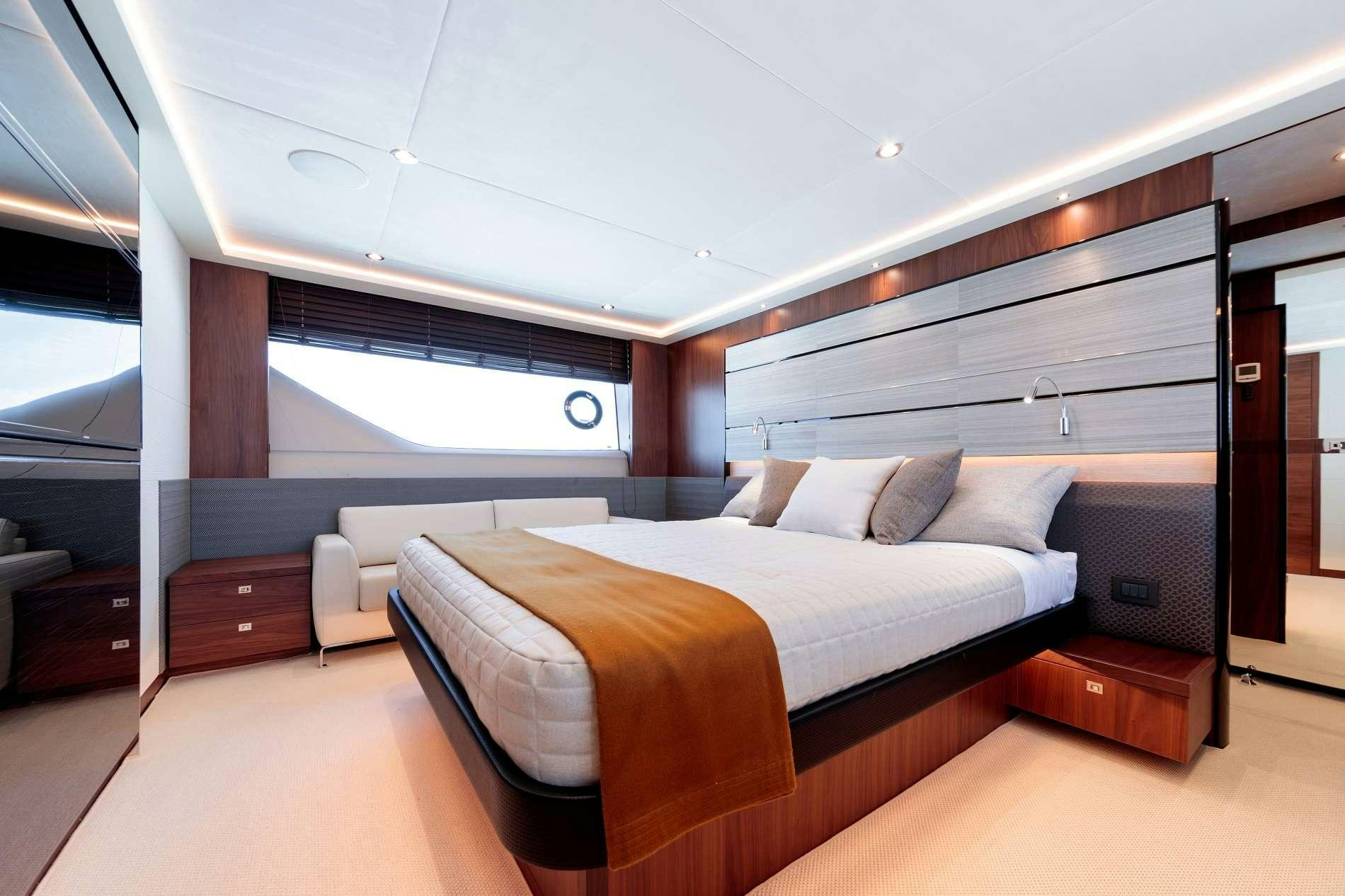 a room with a bed and a desk aboard NELENA Yacht for Charter