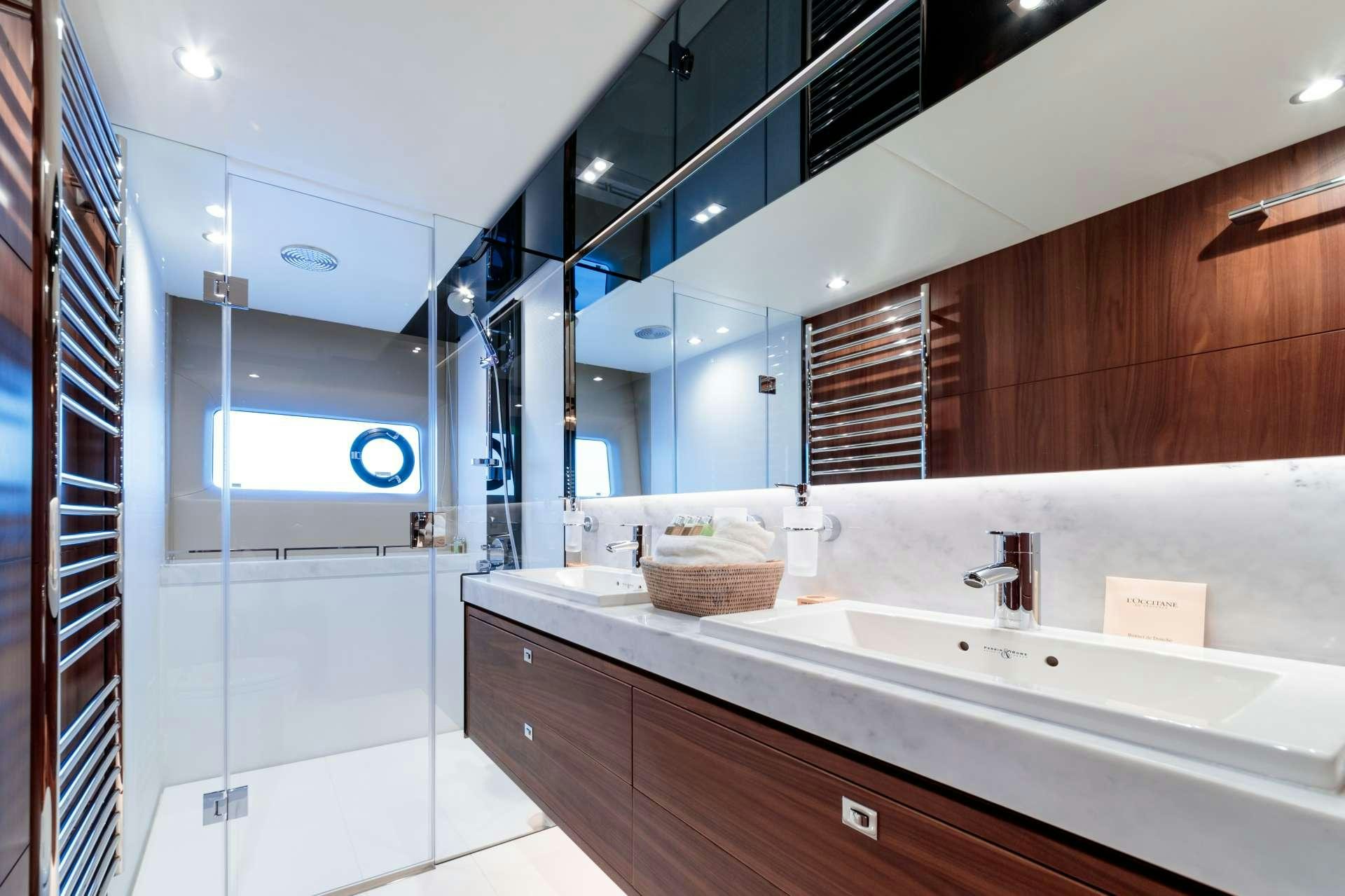 a bathroom with a large mirror aboard NELENA Yacht for Charter