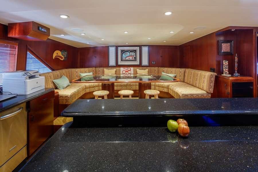 a kitchen with a large island aboard BLACKWOOD Yacht for Charter