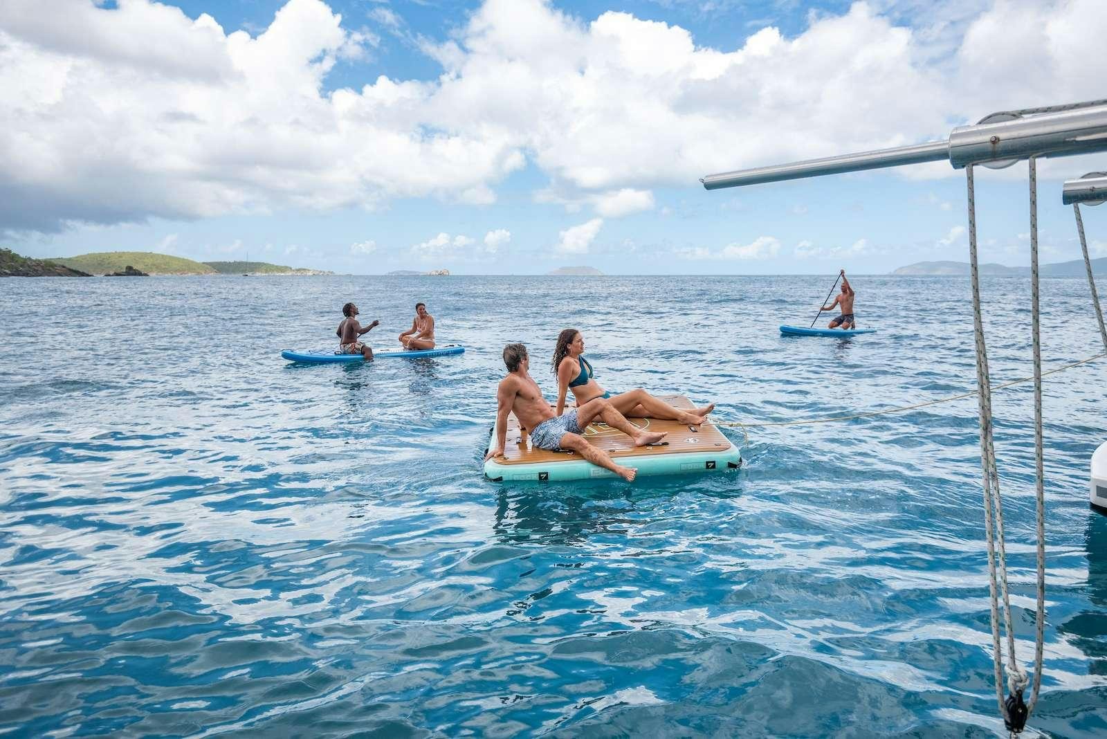 a group of people in the water aboard TIME OUT Yacht for Charter