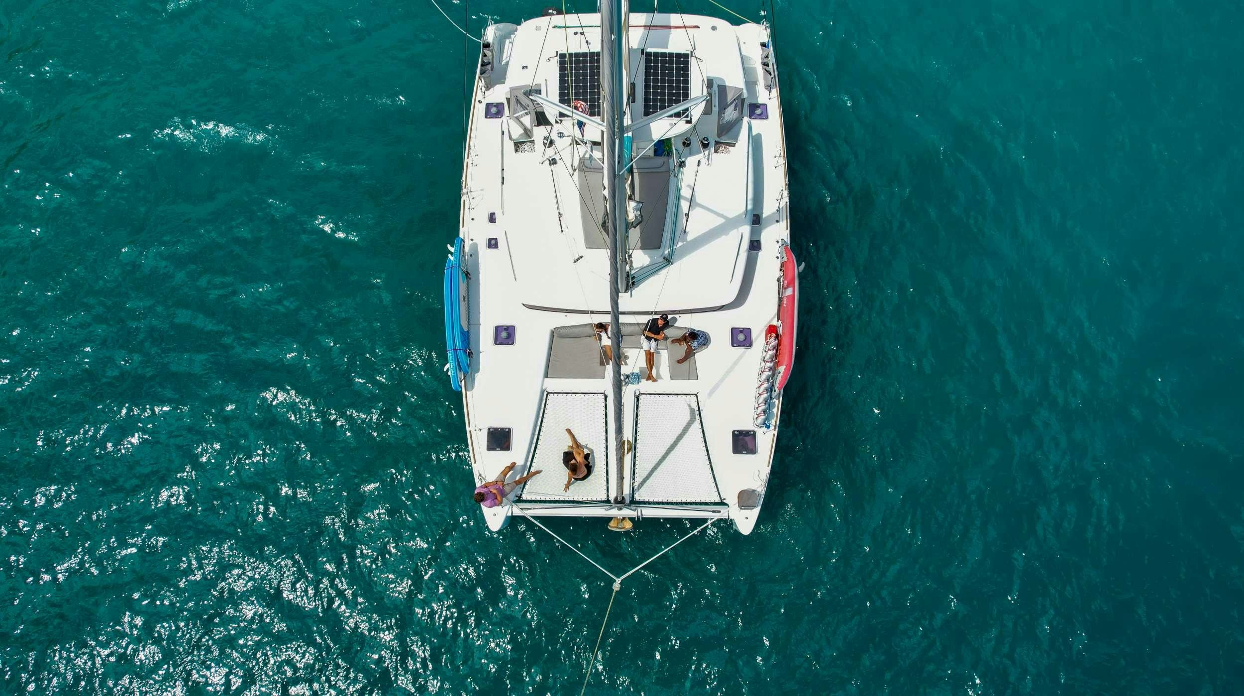 a white boat in the water aboard TIME OUT Yacht for Charter