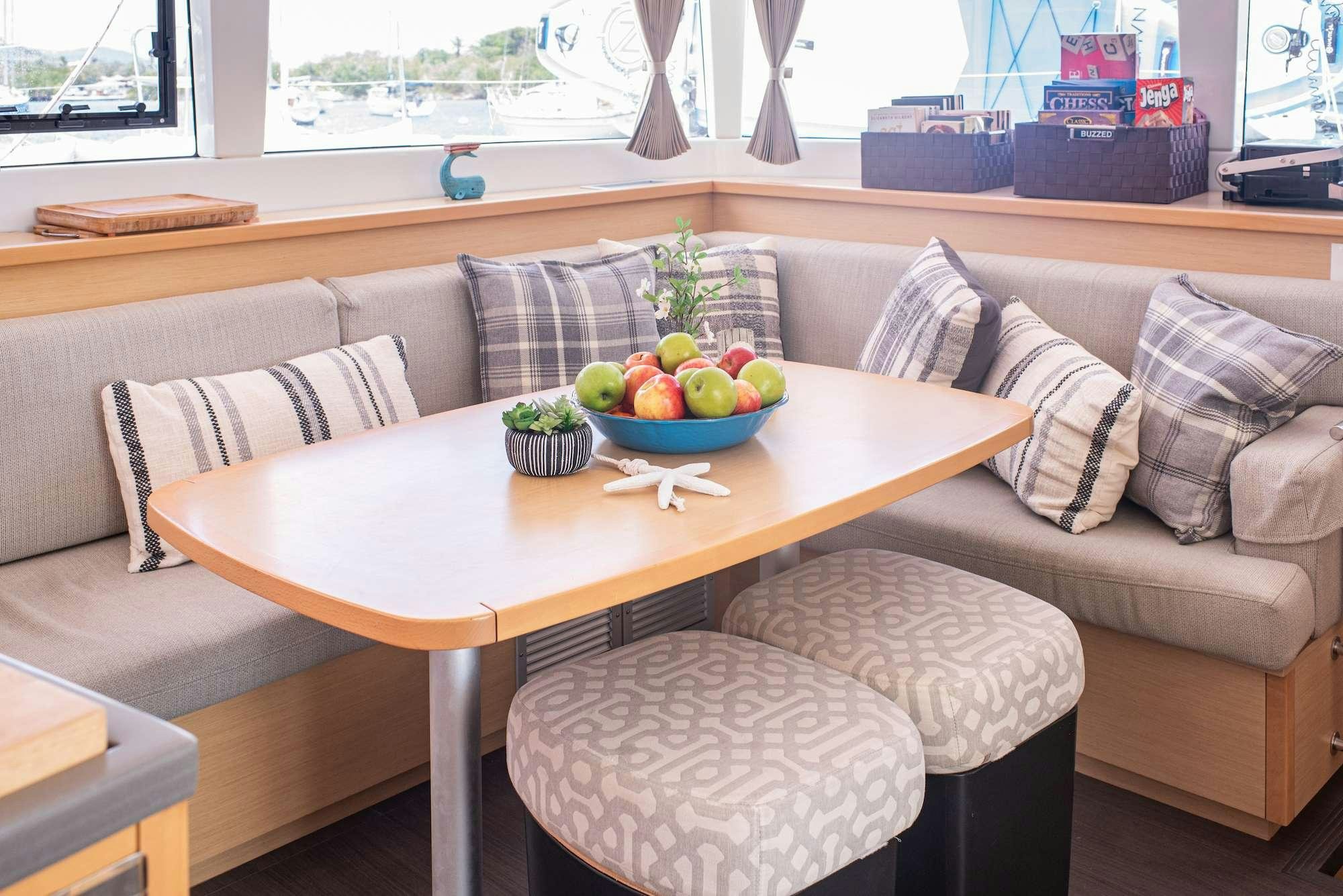 a table with a bowl of fruit on it aboard TIME OUT Yacht for Charter