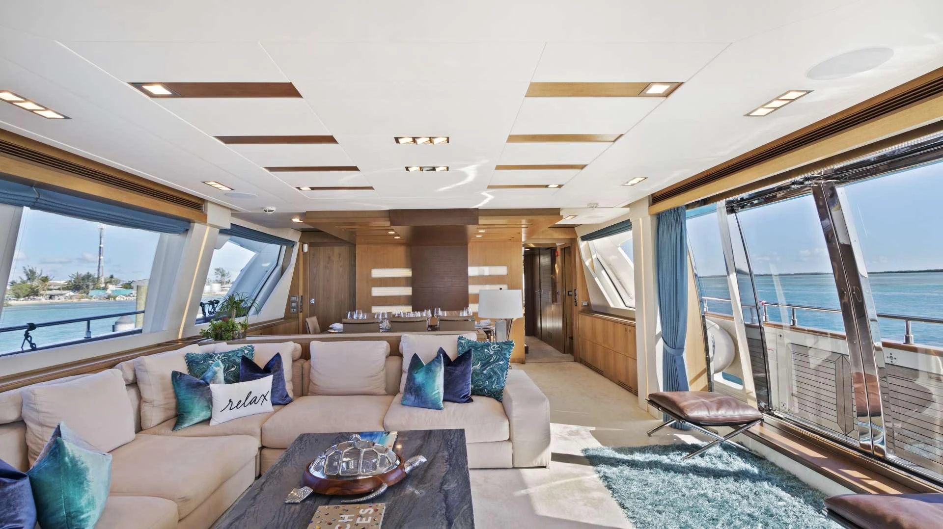 The salon offers a spacious and luxurious seating area with panoramic ocean views. aboard LA MAR Yacht for Charter
