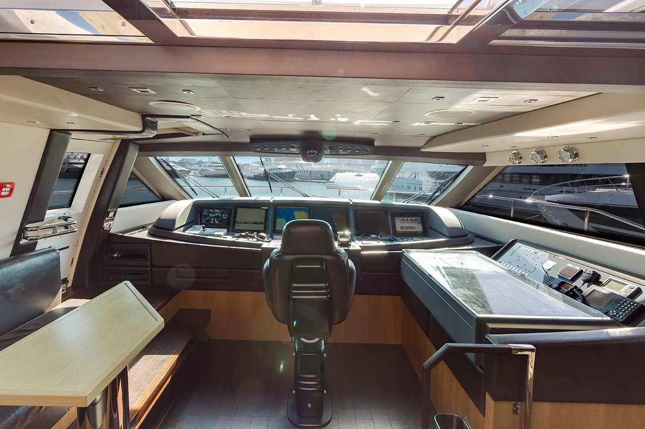 The helm station features advanced navigation equipment and a panoramic view. aboard LA MAR Yacht for Charter