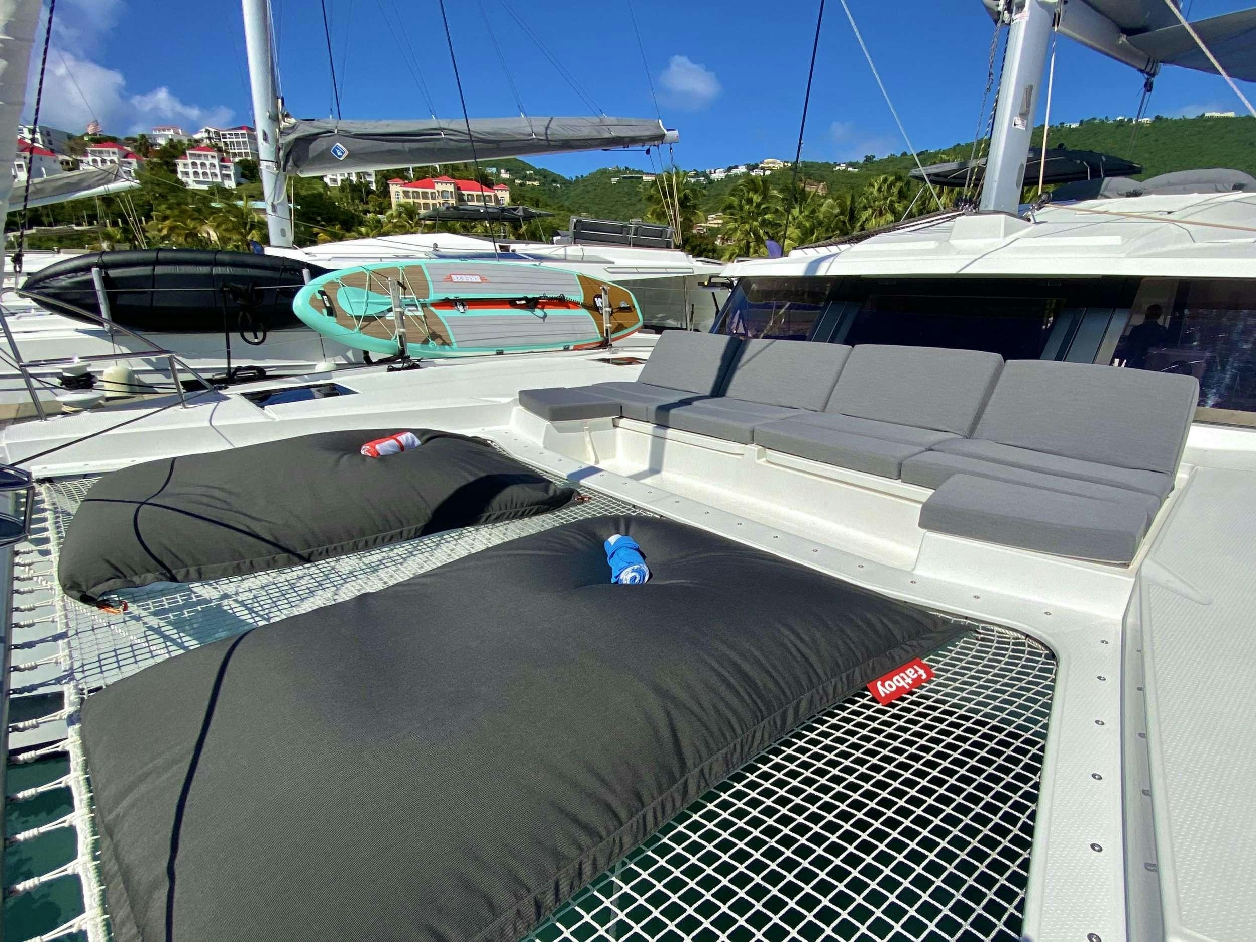 a view of the roof of a car with a surfboard on it aboard O.V. Yacht for Charter