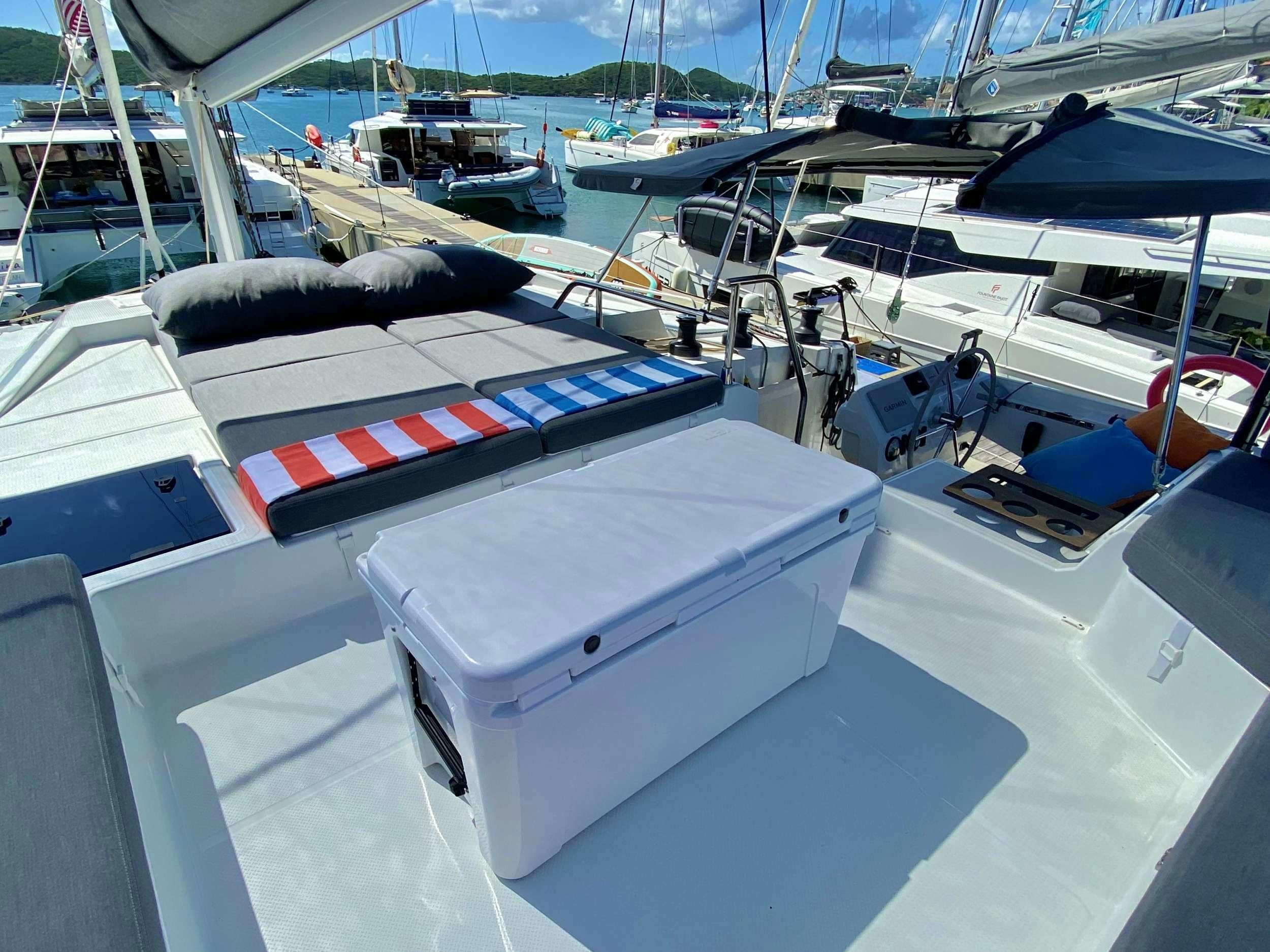 a boat dock with boats aboard O.V. Yacht for Charter