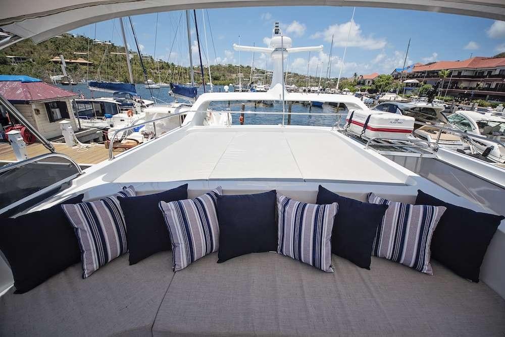 a boat dock with many boats aboard COOL BREEZE 65 Yacht for Charter