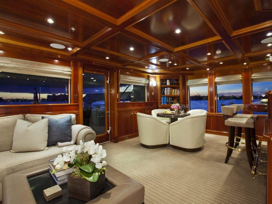 a living room with a large window aboard LEVERAGE Yacht for Charter