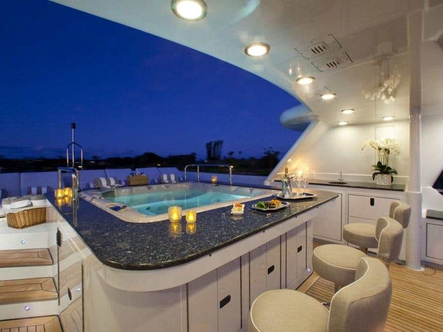 a large kitchen with a large marble counter top aboard LEVERAGE Yacht for Charter