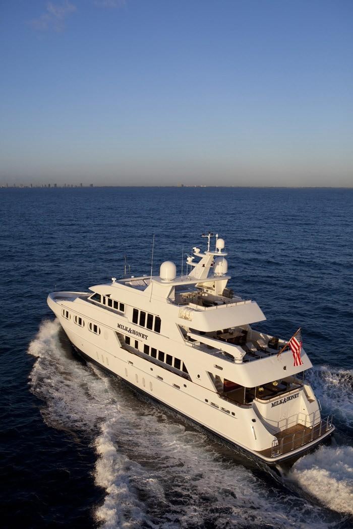 a large white ship on the water aboard LEVERAGE Yacht for Charter